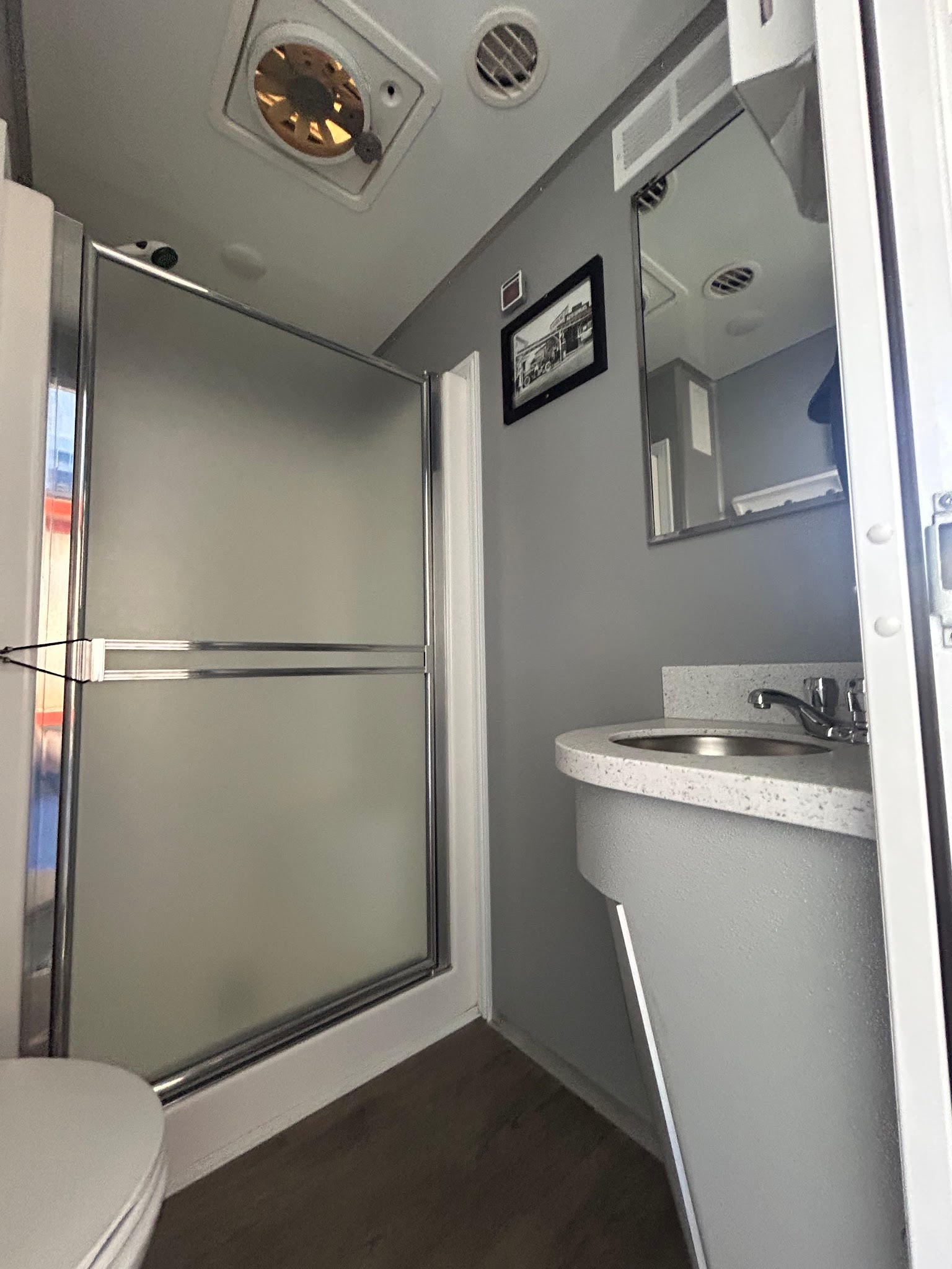 3-stall shower trailer interior — shower and sink