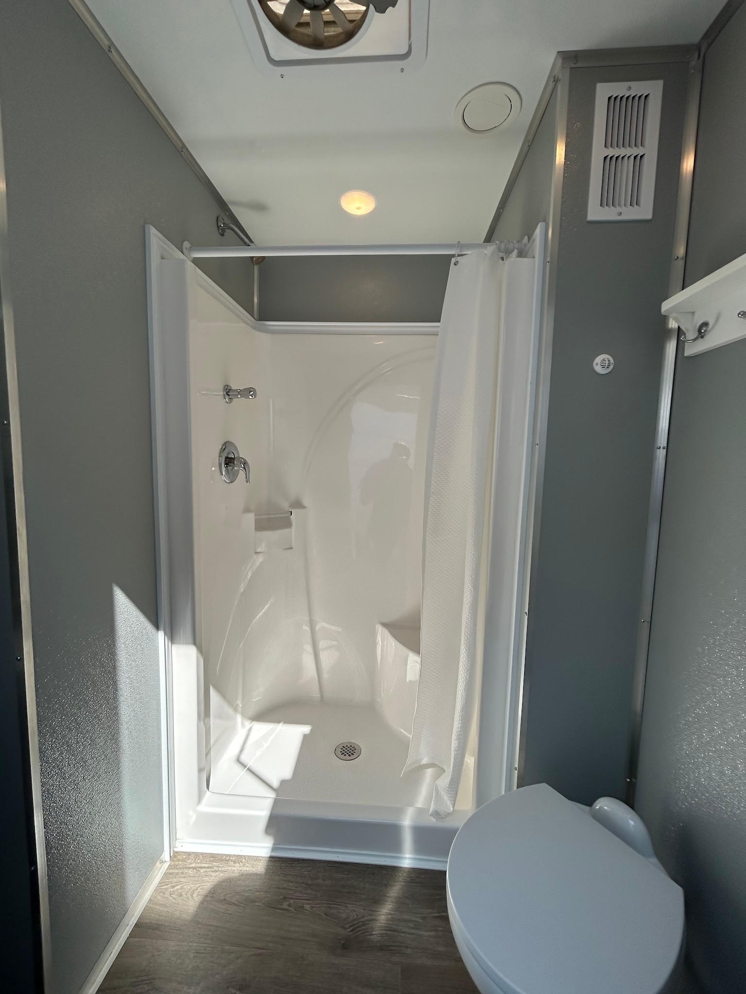 2-stall shower trailer interior — open shower stall