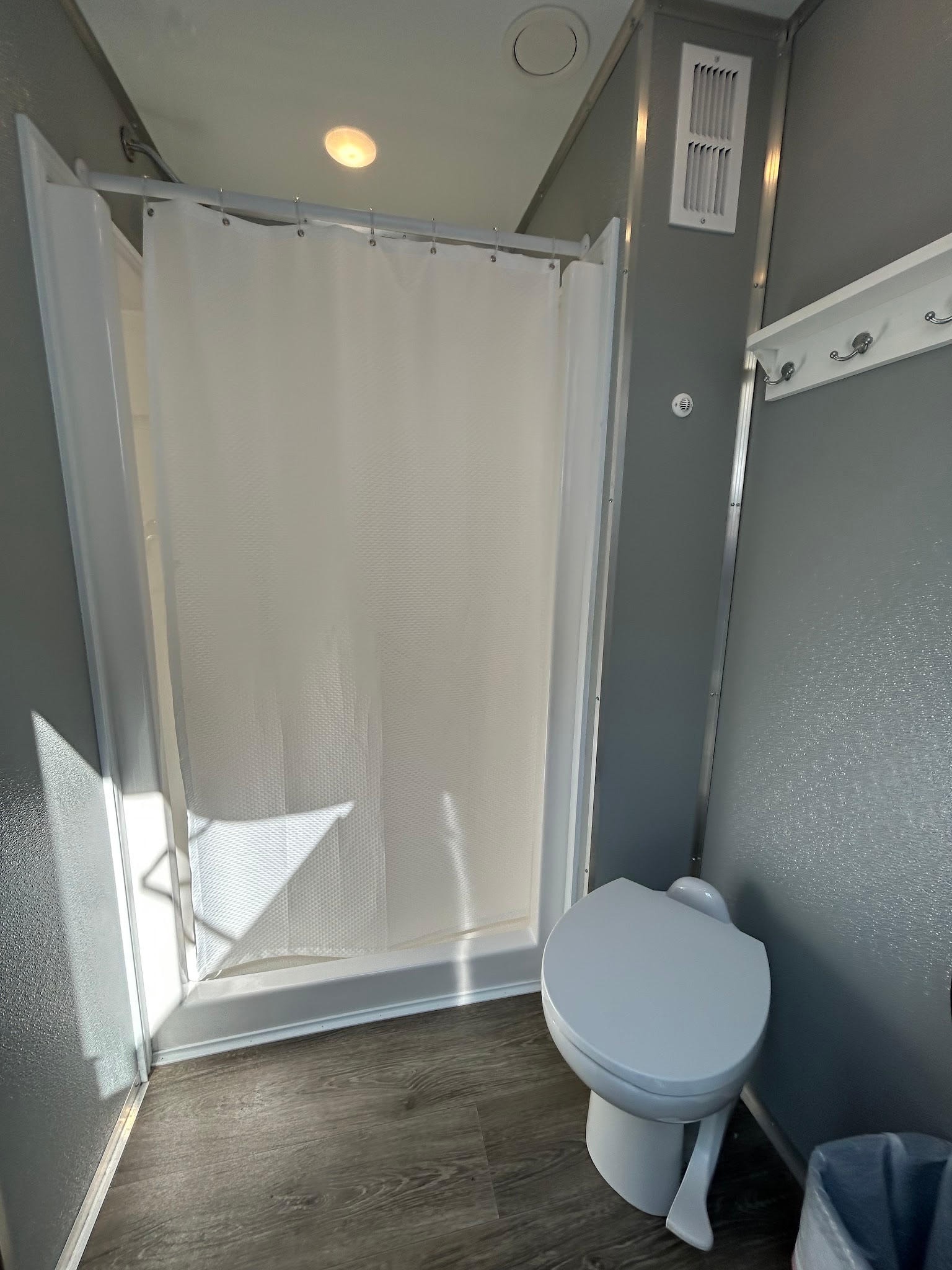 2-stall shower trailer interior — shower and toilet